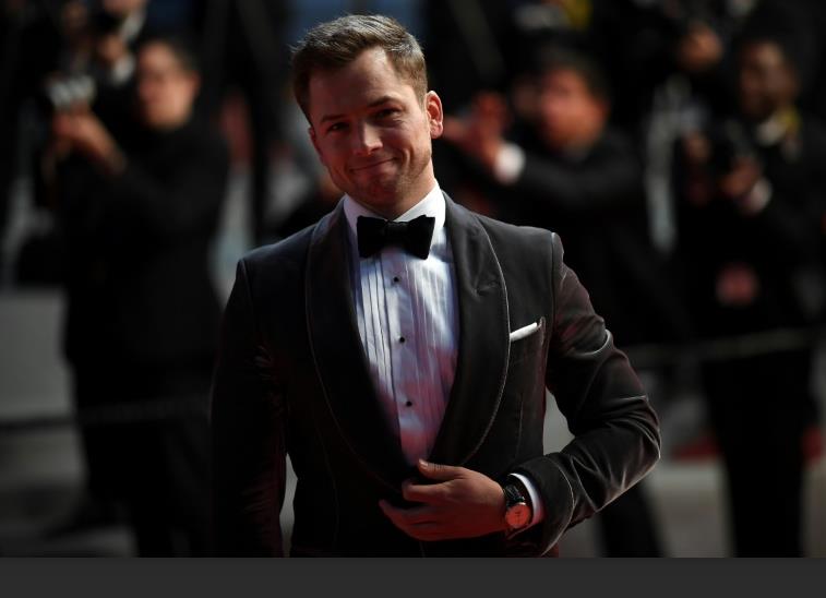 Taron Egerton wears the stainless steel fake Jaeger-LeCoultre Master Ultra Thin Moon 1368420 watch with moon phase.