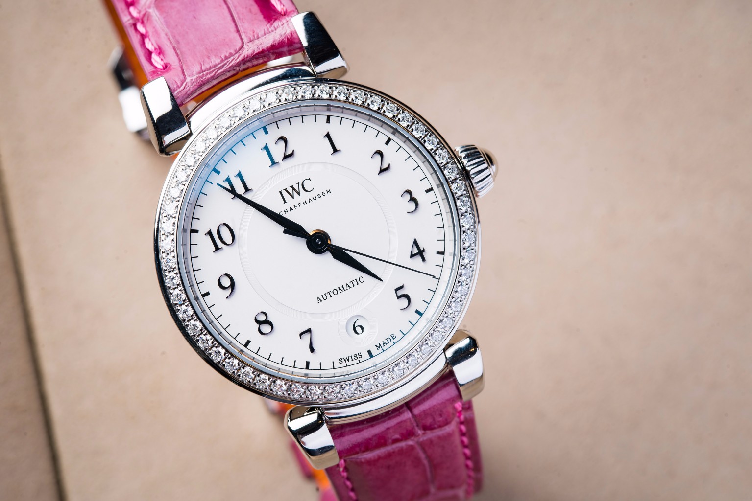 The 36 mm fake watches have pink straps.