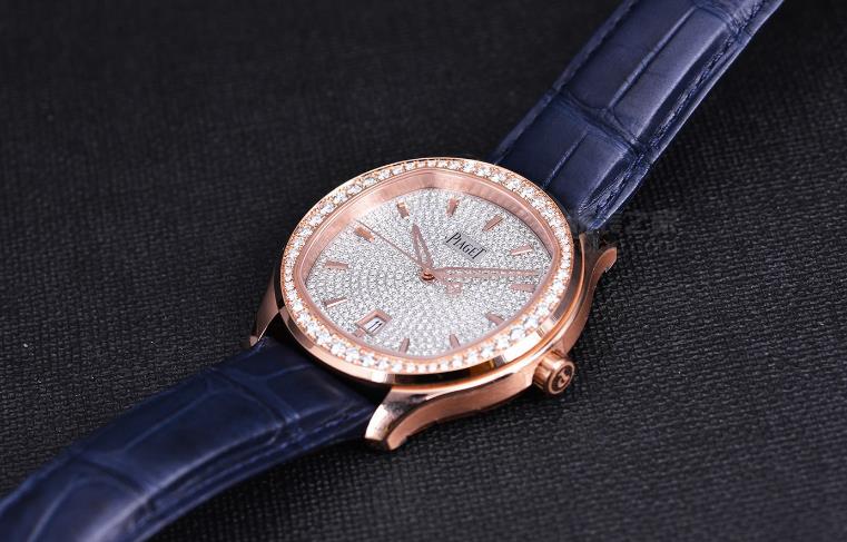 The 18k rose gold copy watches have blue leather straps.